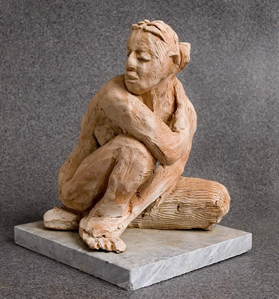 sculpture of a crouching woman