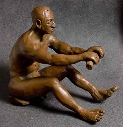 Figure sculpture of a man in rowing postion