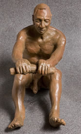 Front view of rowing man sculpture
